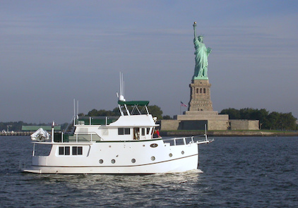 GH47 John Henry in front of the Statue of Liberty